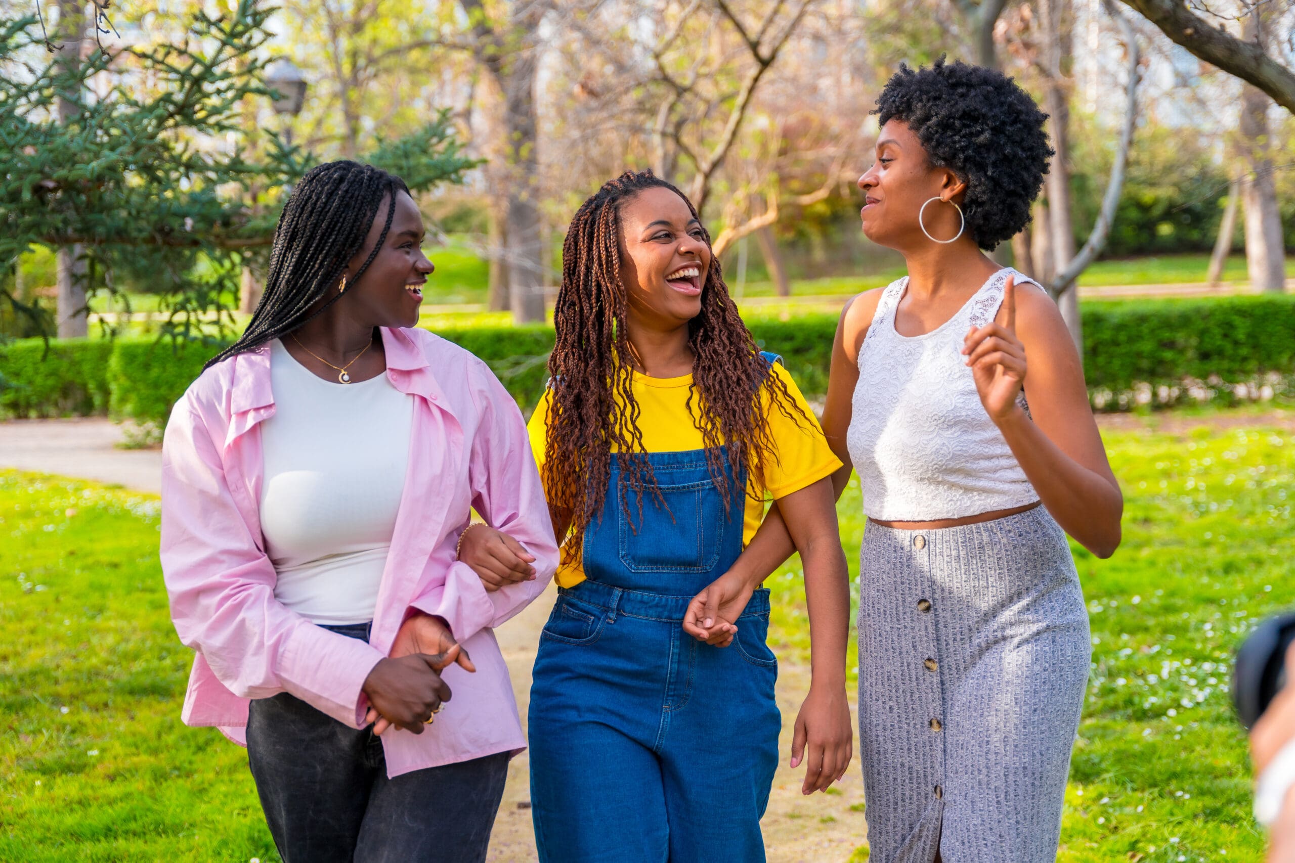 friends-walking-chatting-along-park-scaled.jpg