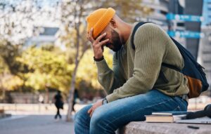 stress-headache-student-outdoor-college-campus-city-with-anxiety-crisis-problem-education-frustrated-man-depressed-university-with-mistake-fail-fatigue-from-studying-scaled.jpg