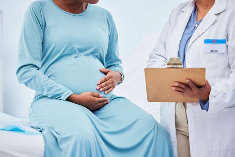 pregnant-woman-doctor-hands-checklist-hospital-consulting-gynecology-service-healthcare-test-exam-results-medical-gynecologist-nurse-pregnancy-charts-clipboard-clinic-bed-scaled.jpg